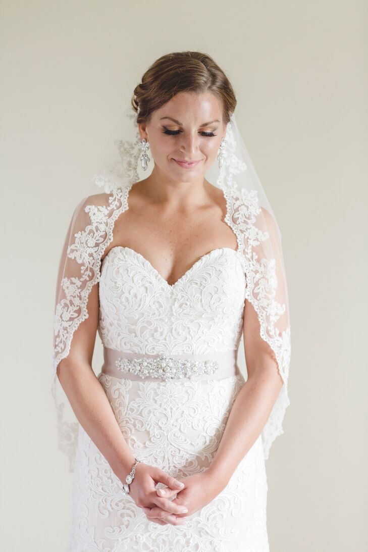 The sweetheart strapless lace gown was accessorized with a blush beaded sash, vintage-inspired jewelry and a romantic matilla-style veil.