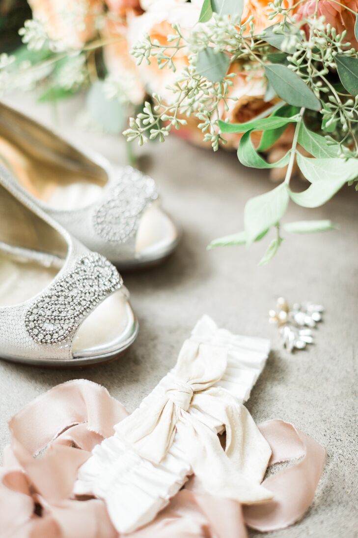 Intricate beading decorated the toe of Bonnie's peep-toe ivory satin heels.