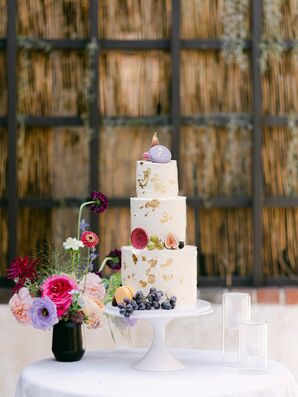 Three-Tier Wedding Cake Accented With Jewel-Tone Flowers