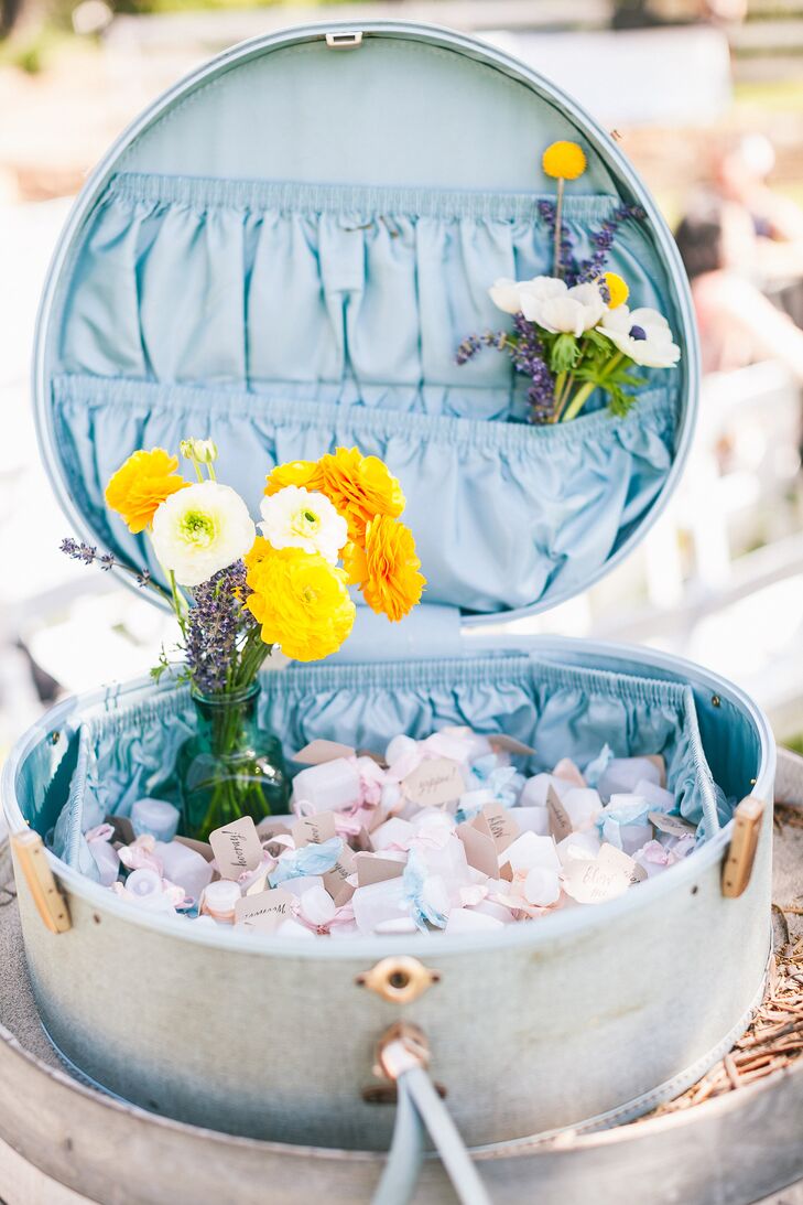 At the outdoor ceremony, bottles filled with bubbles were given to guests to blow when the couple walked back up the aisle during their recessional.