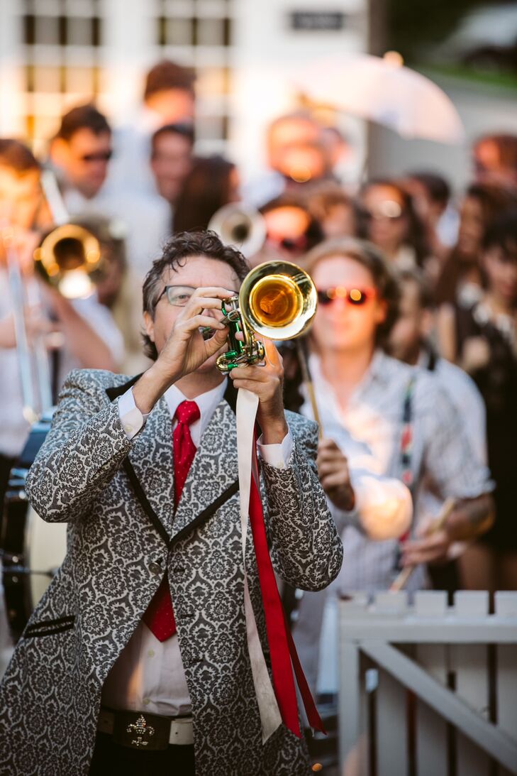 Jill and Conor decided to kick off the evening’s festivities with a bang with a surprise entrance at the reception. A lively New Orleans-style brass led the newlyweds and their wedding party second line style onto the Easton Hampton Point’s deck to the beat of “When the Saints Go Marching In.”