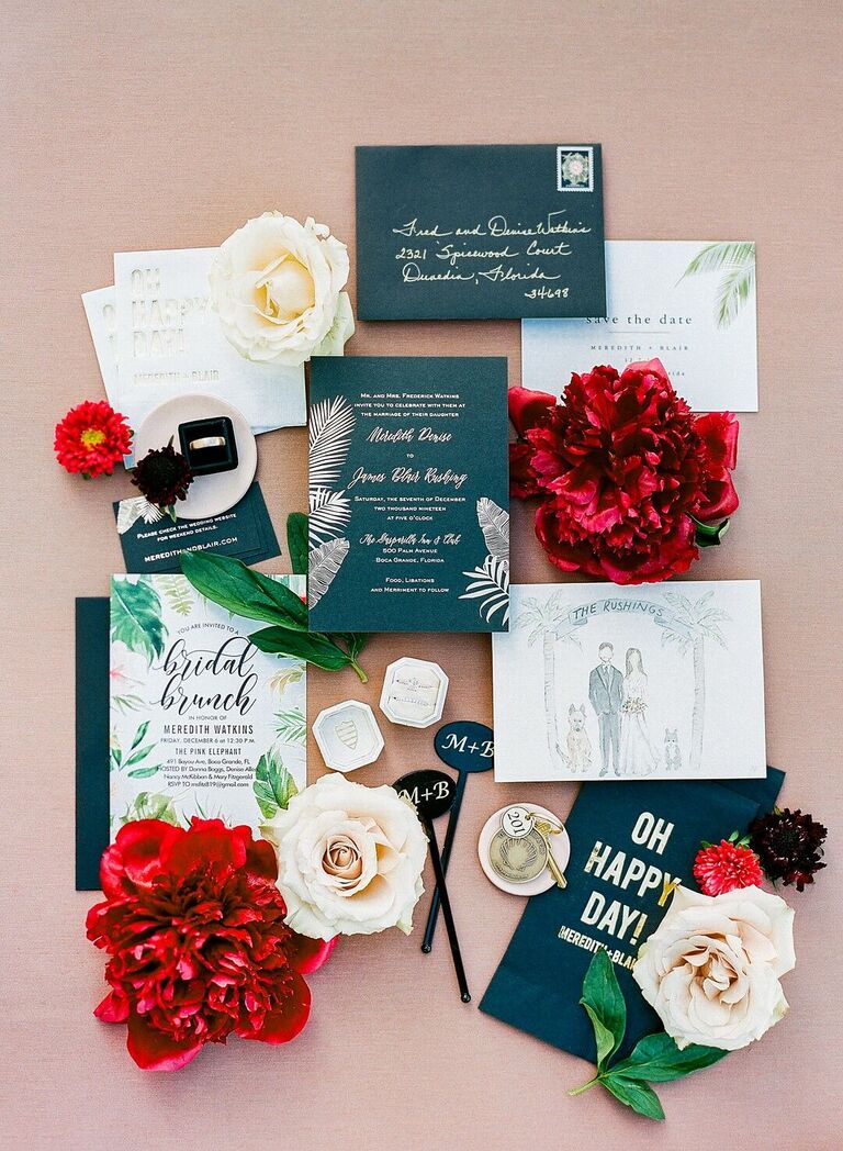 Glam black-and-white wedding invitation suite with tropical leaf illustrations