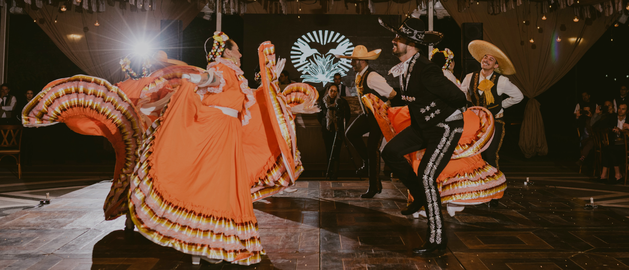 A group of dancers in festive traditional attire.