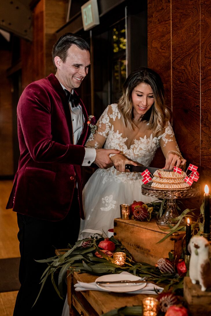 Couple Cutting a Classic Danish Wedding Cake