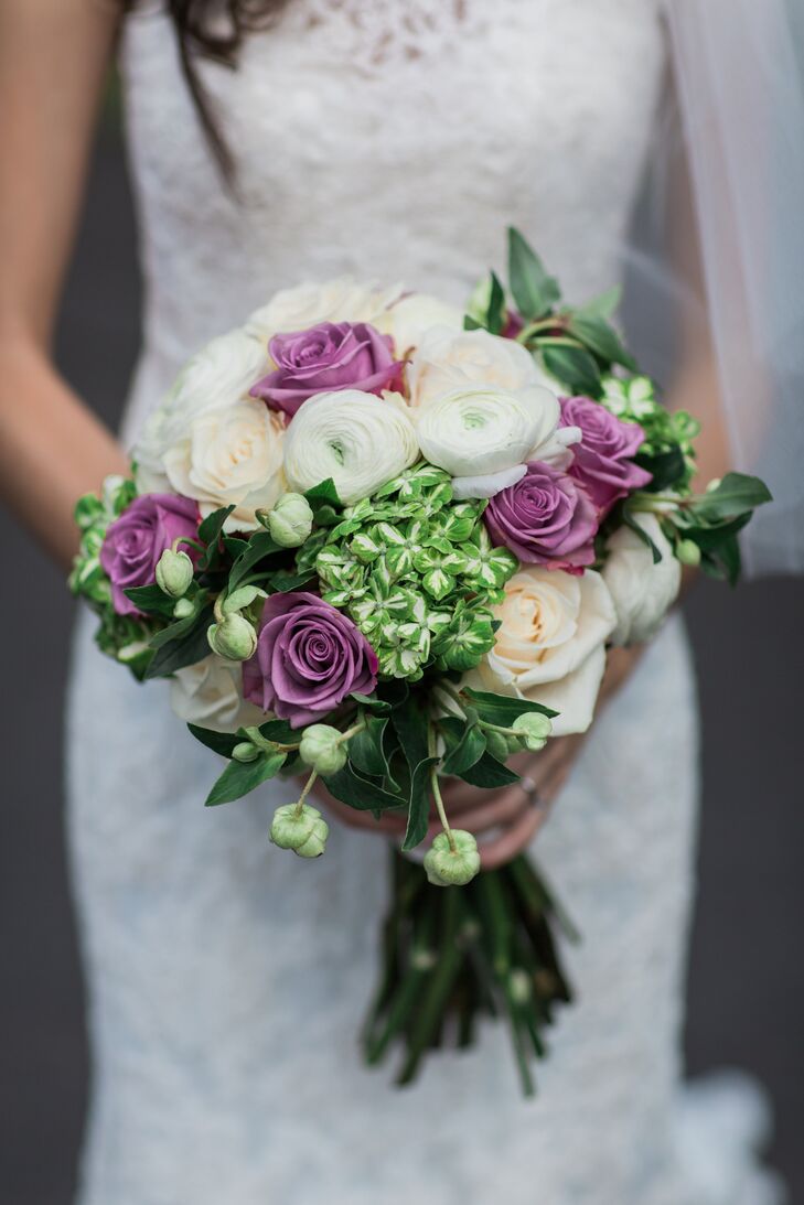 Arrangements of baby's breath dotted tables, while Tara carried a green and lavender bouquet comprising a fresh mix of ranunculus and roses.