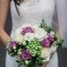 Arrangements of baby's breath dotted tables, while Tara carried a green and lavender bouquet comprising a fresh mix of ranunculus and roses.