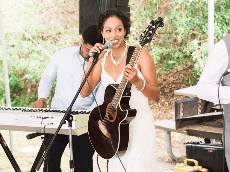 Bride performing song for her partner as a first dance alternative.