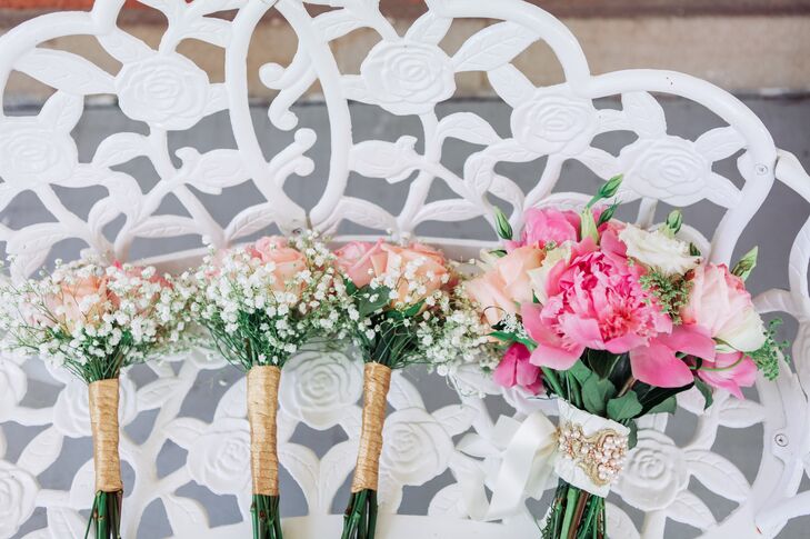 Angie's bridesmaids carried small bouquets of blush roses and baby's breath. Angie herself carried a bouquet of pink peonies and white and blush roses.