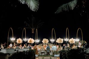 Long Dining Table, Floor Standing Chandeliers Overhead, Pampas Centerpieces at Outdoor Night Reception