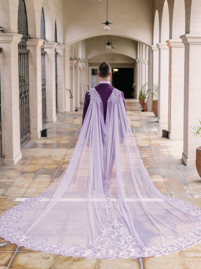Lavender tulle cape at fairytale-inspired wedding