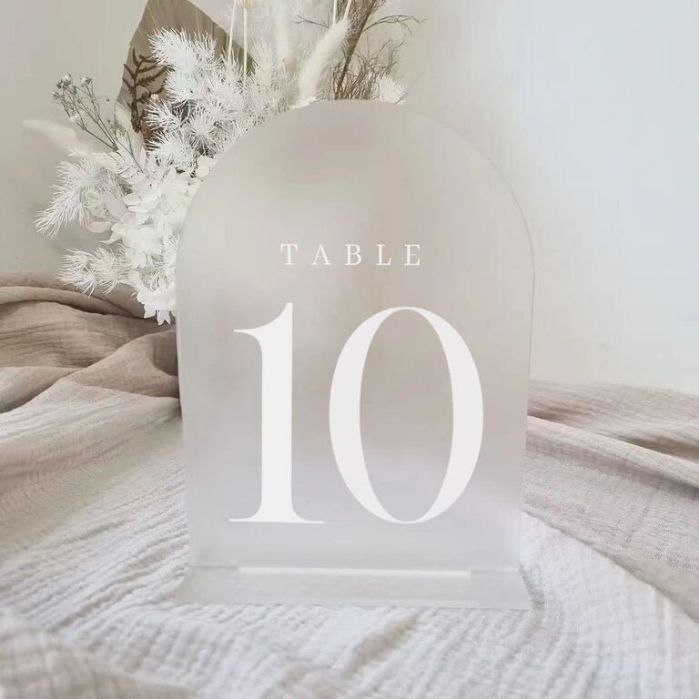modern wedding table number idea frosted acrylic sign with arched shape and white lettering