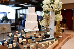Dessert Table with Modern Cake, Macarons and Mini Cupcakes