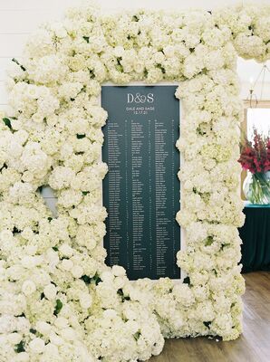 Emerald Green Seating Chart Surrounded by Cascading White Flowers