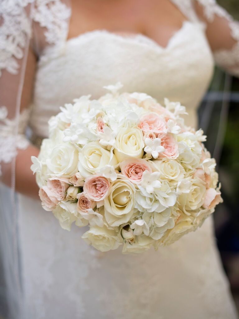 round wedding bouquet with white and pink roses and stephanotis