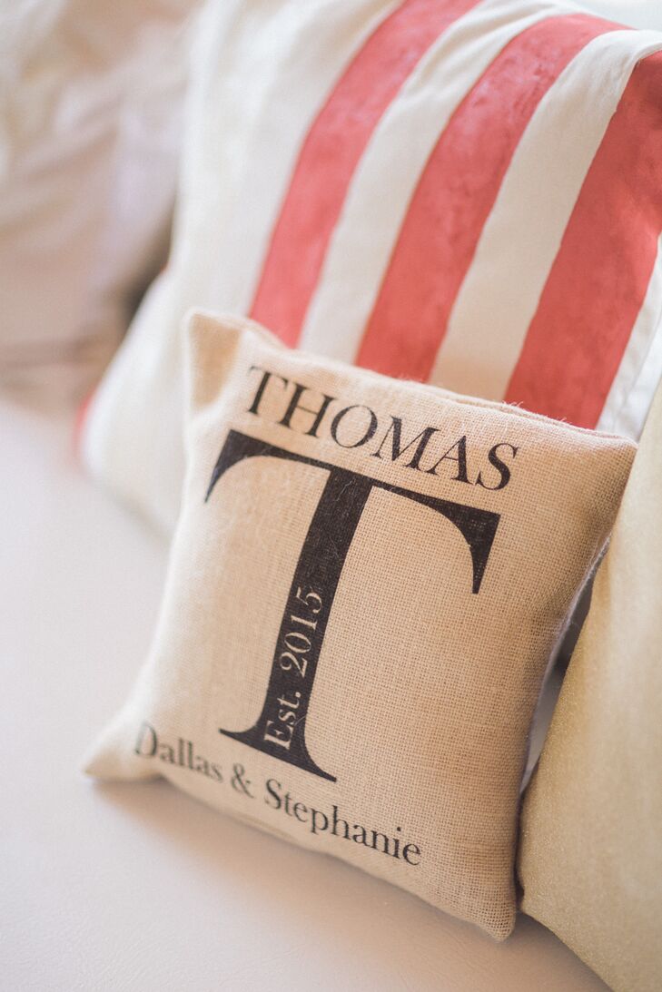 To make their indoor space more personalized, Stephanie and Dallas also had a few custom pieces. Aside from an embroidered “Mr. & Mrs.” accent, they had a neutral pillow with their name, wedding year and new last name printed on the front.