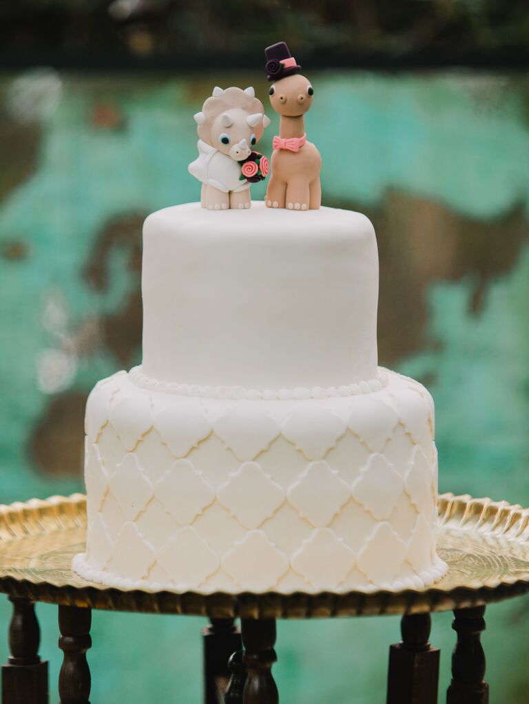 Two dinosaurs as funny animal wedding cake toppers. 