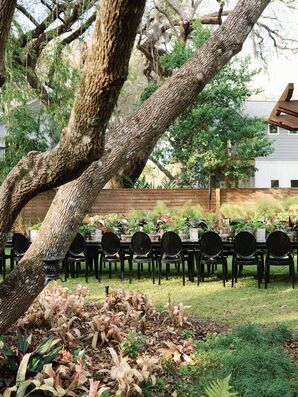Outdoor Wedding Reception With Black Acrylic Ghost Chairs
