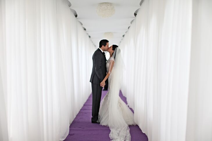 "A lot of my wedding was inspired by 'The Sound of Music', and I knew I wanted a super long veil like the character Maria," Colleen says. "My mom sewed lace along the edge for a more ornate look." The veil blended in nicely with her Reem Acra ivory wedding dress that was accented in lace.
