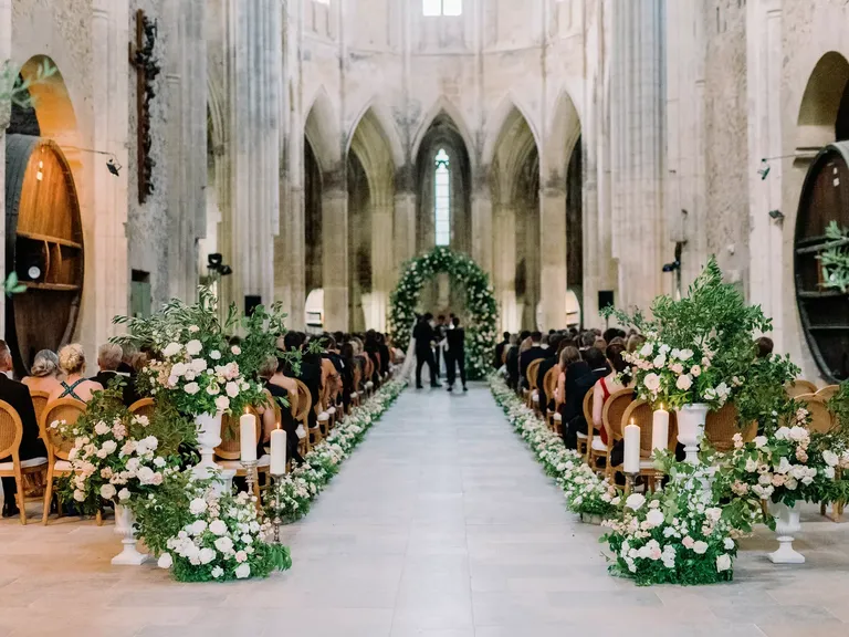 Luxurious Ceremony Aisle in Historic French Venue, White Flowers and Greenery, Verdant Arch