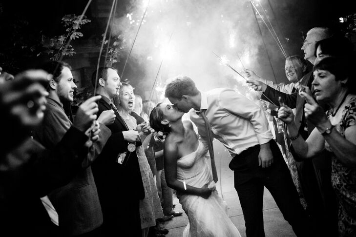 Michelle and Jeff shared a kiss as they made their exit from Alderbrook Resort and Spa. Friends and family members paved the way for their exit, holding sparklers above their heads.