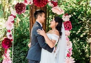 Classic Lace-Trimmed Wedding Veil and Paper Flower Arch