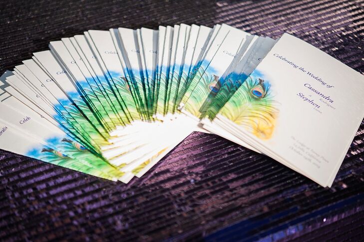 Guests received white programs accented with beautiful peacock feather watercolor designs. The plum-colored text reflected the main hue that accented the day.
