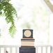 The square groom's cake was three layers and had a nautical theme. Each layer was accented with rope-like piping and the top layer was marked with a anchor embellishment.