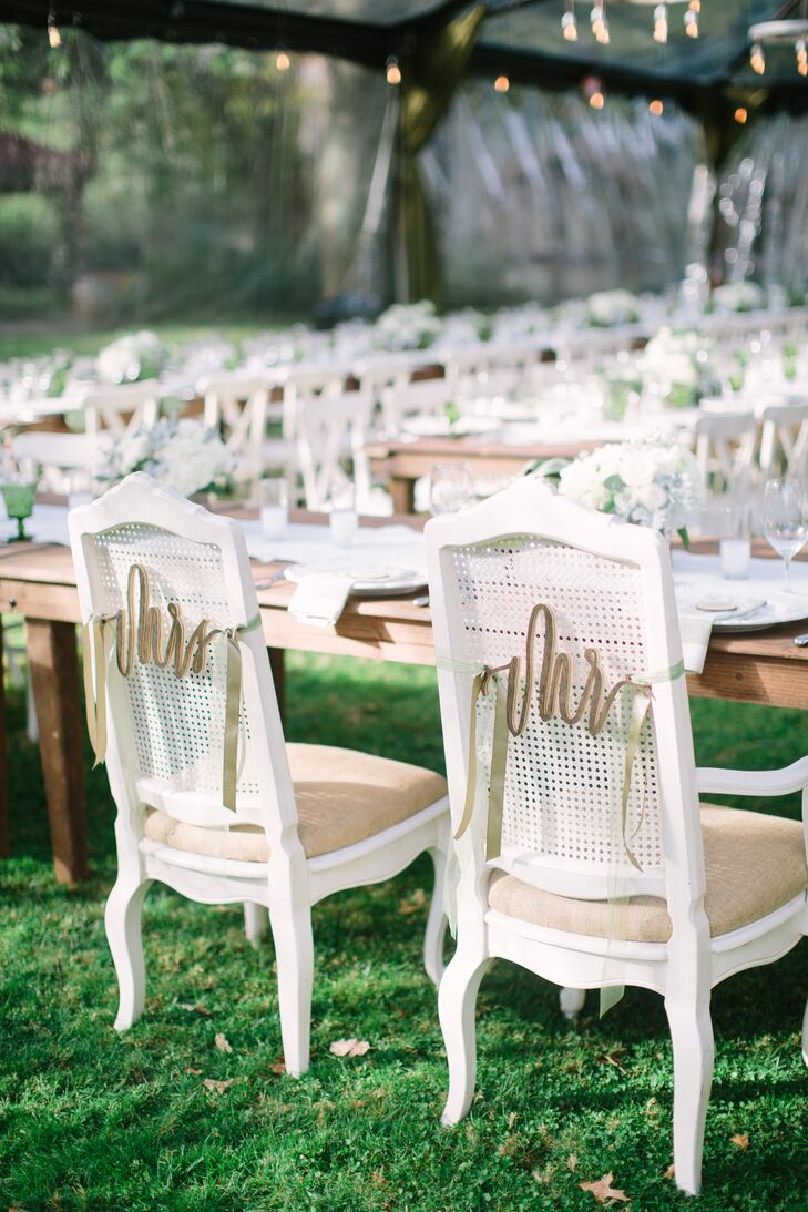 "Because it was pouring, we had a clear tent that made the whole space glitter with dripping Edison lights and chandeliers, while it was still light out you could see the trees and rain falling and then once it got dark the whole thing glowed with a beautiful orange light that made everyone feel cozy and at home," says Sloane.