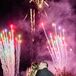 Couple Kissing During Post-Wedding Fireworks