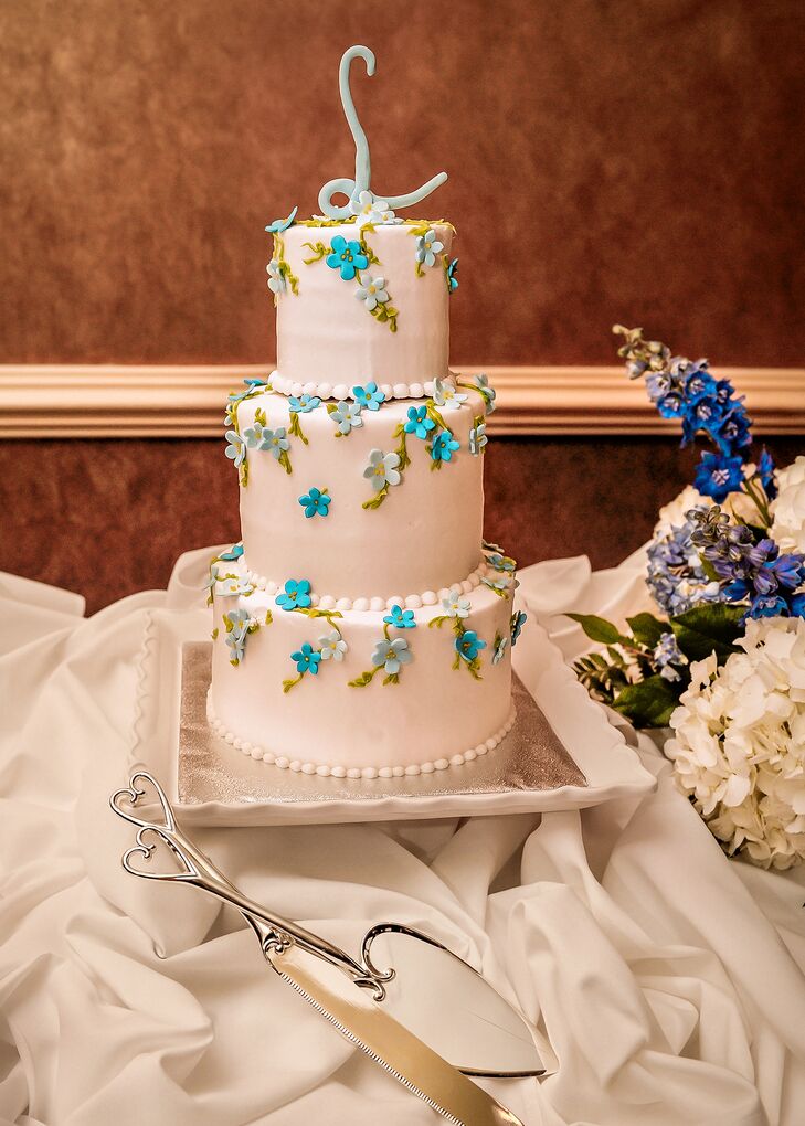 Classic White Wedding Cake With Blue Flowers