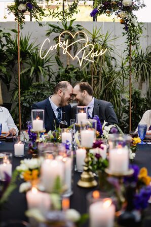 Grooms and Neon Signage at Wedding Reception