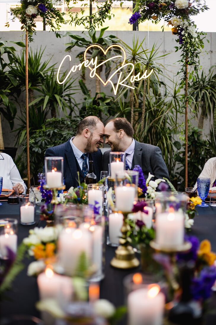 Grooms and Neon Signage at Wedding Reception
