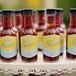 Katy and Adam went a nontraditional route for their favors with barbecue sauce bottled in glass bottles. They personally labeled and filled the sauce themselves, giving guests a treat to remember the day.