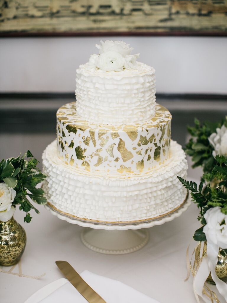 buttercream wedding cake with gold leaf foil