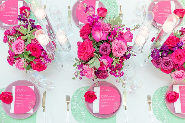 White Table With Colorful Place Settings, Pink Menus and Flowers, Turquoise Mat