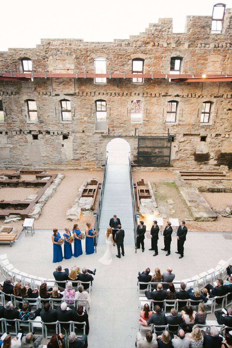 Wedding ceremony with industrial ruins as the backdrop