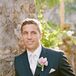 The groom wore a light pink orchid wrapped in white ribbon for a boutonniere.