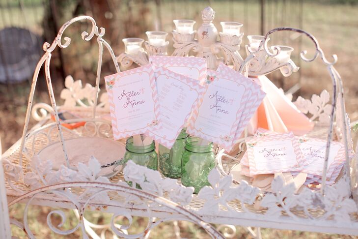 Anna and Adler's blush chevron ceremony programs doubled as fans, so their guests could stay cool in the Texas outdoors.