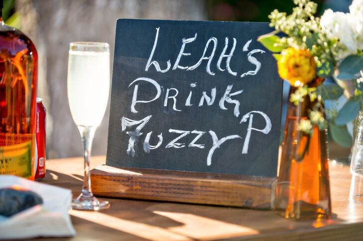Two signature cocktails were served in addition to the full bar. The bride's custom cocktail was called a “Fuzzy-P,” and was a lighter peach flavored vodka option.