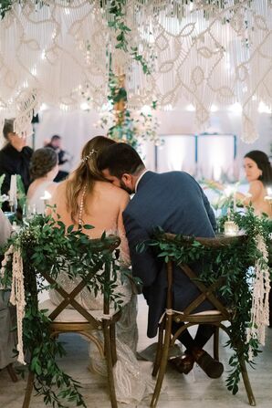 Whimsical Cross-Back Sweetheart Chairs with Greenery