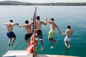 Guests Jump Off Dock at Private Estate Wedding at Lake Michigan