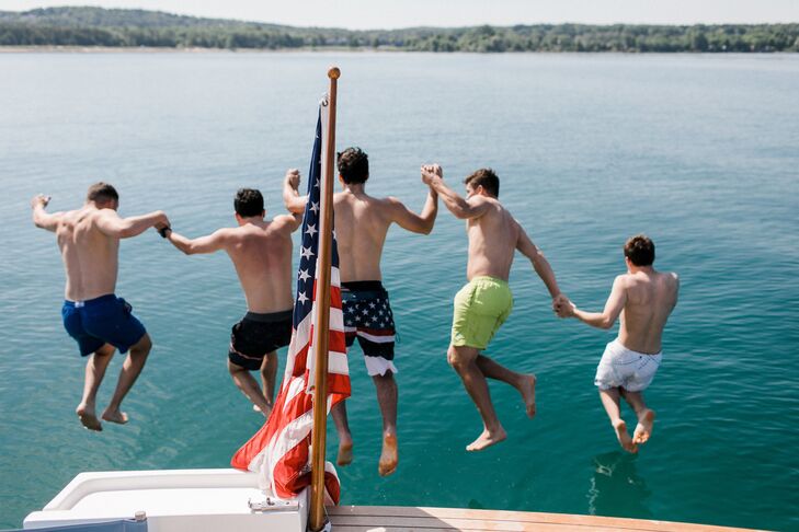 Guests Jump Off Dock at Private Estate Wedding at Lake Michigan
