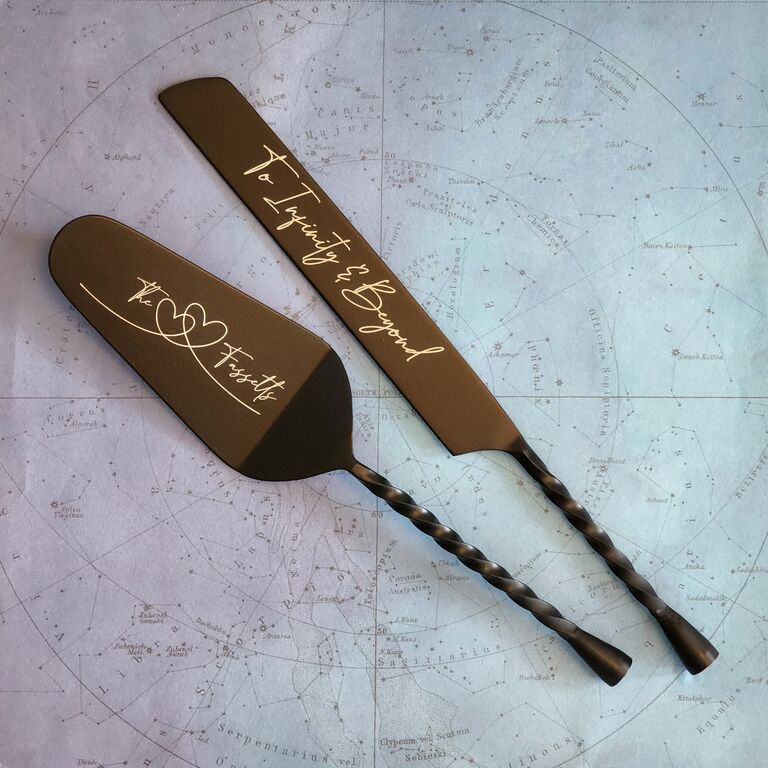 Black engraved cake cutting set by Gibb Daan. 