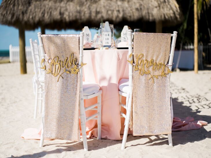 The head of the table was saved for Nicole and Zachary, who separated their chairs from the rest with laser-cut "bride" and "groom" signs.