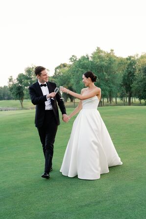 Bride in Elegant Sweetheart A-Line Dress and Groom in Tuxedo Toast on Golf Course