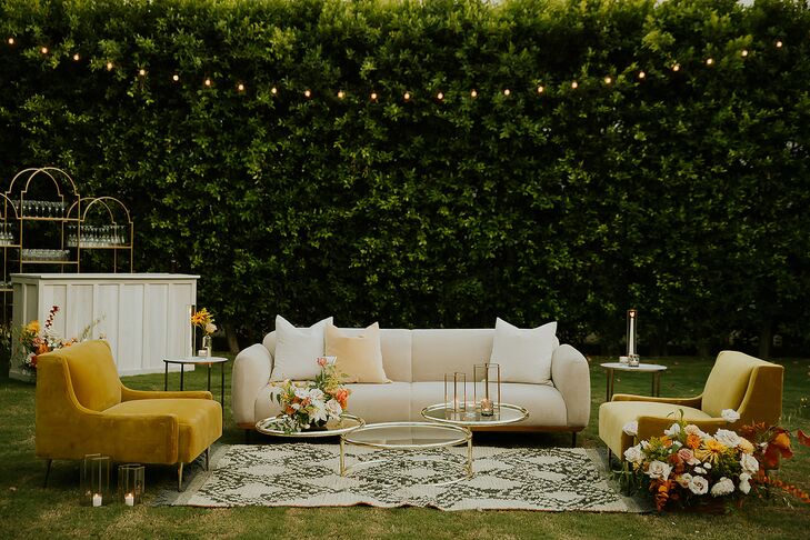 Cocktail Hour Lounge Vignette, Sofa and Plush Chairs, Rug, Coffee Tables and Gold Details in Garden