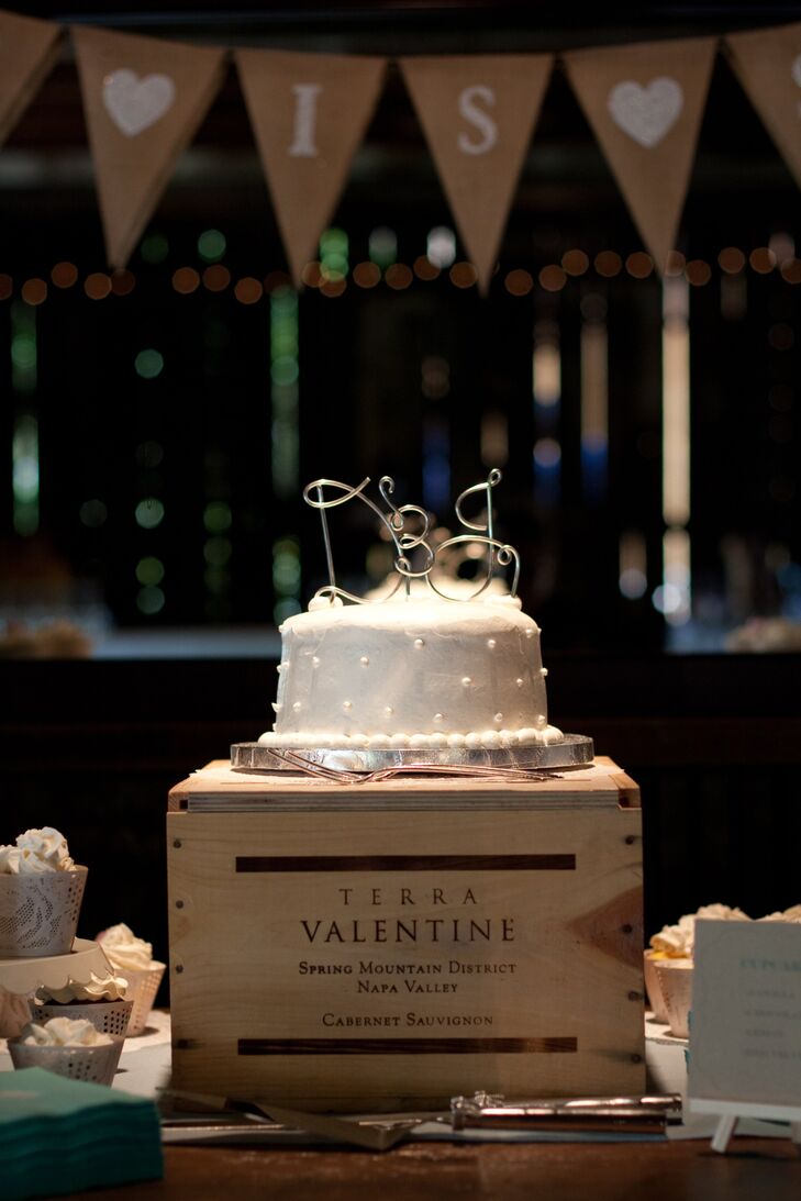 A whimsical wire cake topper added a personal touch to Jen and Dario's pearl-studded wedding cake.