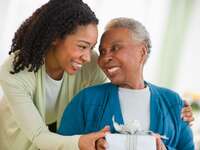 Daughter-in-law giving a gift to mother-in-law