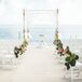 The day kicked off with an intimate ceremony on the beach at the Drop Anchor Resort. Bunches of pink hydrangeas and oversized greenery lined the aisles, adding a fresh punch of color to the sandy white beach. A simple bamboo wedding arch stood at waters edge, draped with airy sheer fabric and a whimsical backdrop of striking white starfish.  rn