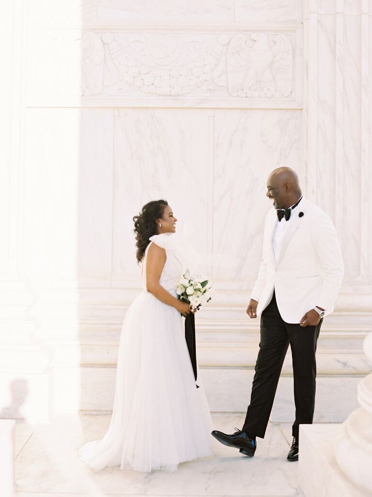 Bride and groom laughing together